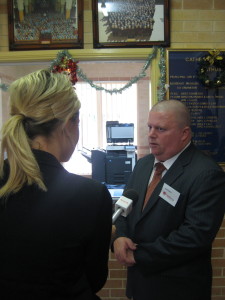 Defib Shop Mr Carpet Hughes presents to the media about the importance of having defibrillators in the community. 